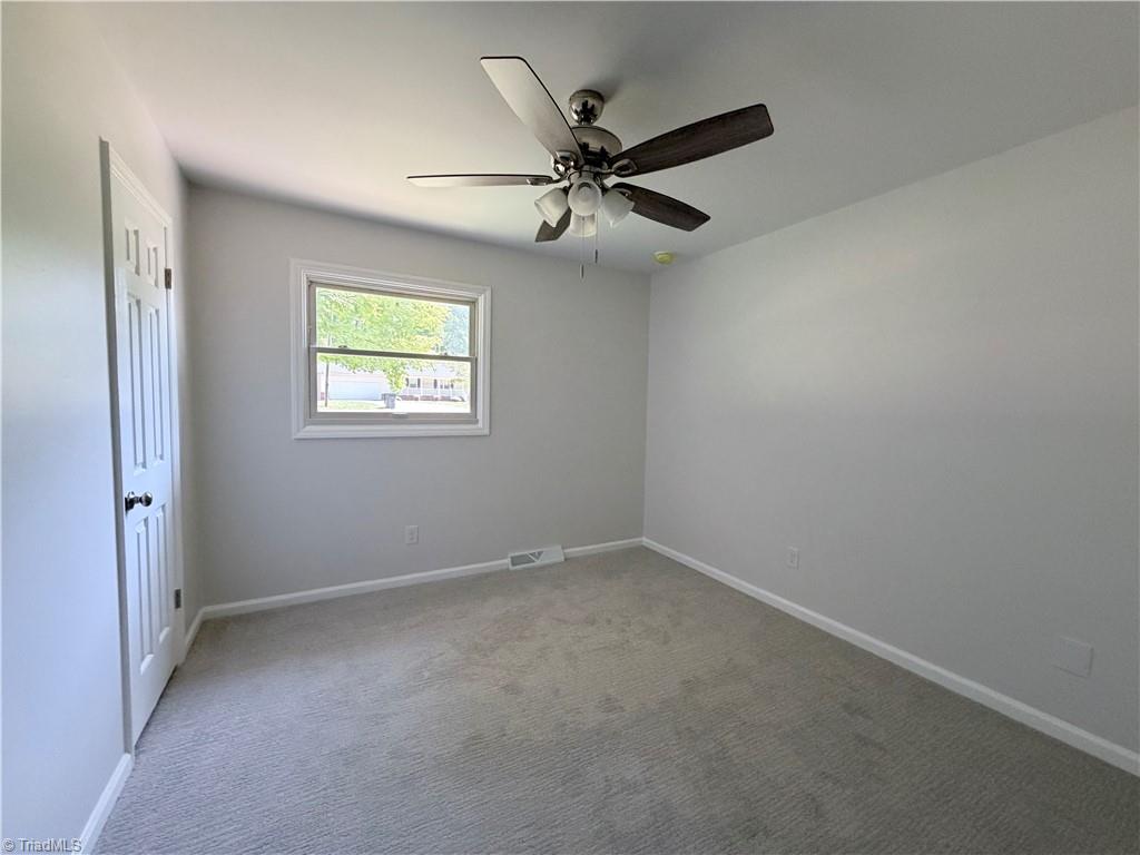 Bedroom with window and ceiling fan